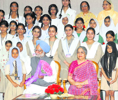 Muslim students with Prime Minister Manmohan Singh and his wife Gursharan Kaur on the occasion of Eid-e-Milad-un-Nabi in New Delhi on Tuesday.
