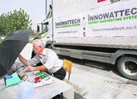 Chief scientist Eugeny Harash measures the electricity generated during a simulation.