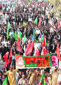 Lawyers and political activists march during a protest rally in Lahore
