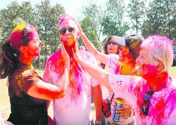 Firang tourists too had a taste of the colours and camaraderie that marked Holi in the tricity