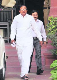 Union Home Minister P Chidambaram comes out of the South Block after submitting a report, containing the reply to Pakistans 30 questions, to the Ministry of External Affairs in New Delhi