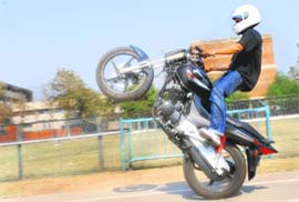 A boy tries out a few stunts on his bike at Parade Ground-17