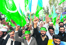 Protesters raising slogans during a celebration rally after the restoration of Pakistan Supreme Court Chief Justice Iftikhar Chaudhry in Islamabad on Monday.