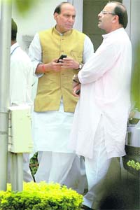 FRIENDS AGAIN: BJP President Rajnath Singh gestures while talking with BJP General Secretary Arun Jaitley after a meeting in New Delhi