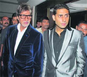 Bollywood actors Amitabh Bachchan (L) and his son Abhishek at the Reebok's Shiamak collection