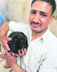 Grieving relatives of a victim at a hospital
