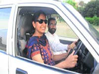 Manjeet Kaur takes lessons in driving from her husband