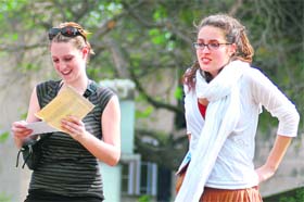 You’ve got mail: That’s what the girl in white seems to be saying as her friend browses through the contents of her letter