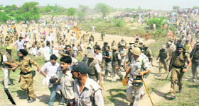 The police disperses crowds as the body of IJP candidate Vijay Bahadur Sonker is taken away by his relatives in Jaunpur on Monday.