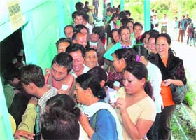 PEOPLE POWER: Voters wait for their turn to cast vote at a polling booth in Karong, Manipur