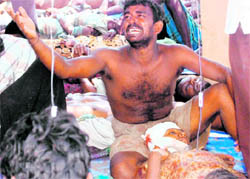 Injured civilians are seen in a make-shift hospital in this photograph released by pro- LTTE group Mercy Mission to Vanni on Monday showing, what they say, wounded fleeing an area still controlled by the LTTE in the no-fire zone at Puthukkudiyirippu in northeastern Sri Lanka.