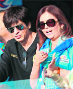 Mumbai Indians' owner Nita Ambani chats with Shahrukh Khan, owner of Kolkata Knight Riders during their team's IPL match at St. George's Park in Port Elizabeth.