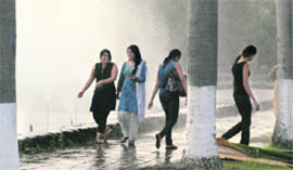 Girls enjoying a cool tryst in the summer heat on the PU campus.