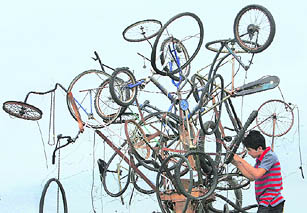 A bicycle tree built by a fine arts student out of junk material in front of the Cultural Centre in Manila for the Earth Day celebrations held recently