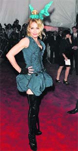 BOOT LEGGER: Madonna looks catty in a creation by Louis Vuitton, with boots and all