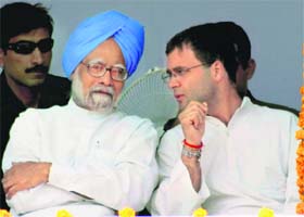 FINAL PUSH: AICC general secretary Rahul Gandhi discusses a point with Prime Minister Manmohan Singh at an election rally in Amritsar