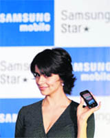 Bollywood actor Gul Panag holds Samsung Star 3G full touch screen mobile phone during its launch in the southern Indian city of Hyderabad recently.