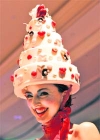 Mouthful of style: Miss Sweet Charity displays her outfit made with chocolate and sugar. AFP photos: Nicholas KAMM