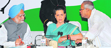 Prime Minister Manmohan Singh, Congress president Sonia Gandhi and Pranab Mukherjee during a Congress Working Committee meeting in New Delhi on Sunday.