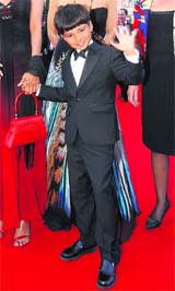 It’s child’s play:Slumdog Millionaire actor Ayush Manesh Khedekar arrives for the screening of the film Looking For Eric at the Cannes Film Festival on Monday