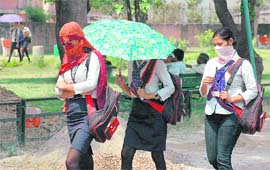 The umbrella was the ideal protective gear on Tuesday. First, it was a shield from scorching sun during the day, and a savior from the showers later in the evening