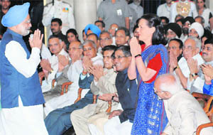 Dr Manmohan Singh greets Congress president Sonia Gandhi after taking oath as the Prime Minister.