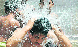 Boys enjoying a splash on a hot afternoon