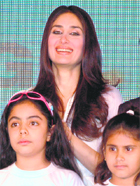 Bollywood actor Kareena Kapoor with kids during an International Cricket Council (ICC) news conference in New Delhi on Thursday.