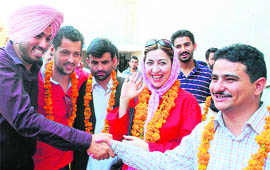 Students of Panjab University welcome foreign guests in front of Gandhi Bhavan on Tuesday