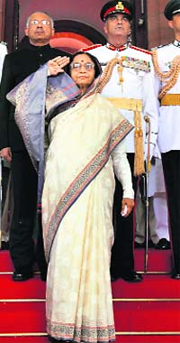 President Pratibha Patil takes the salute after she arrives to address the joint session of Parliament