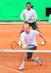 Despite trailing in the first set at this year’s French Open, Paes and his Czech partner Lukas Dlouhy (front) won the men’s doubles title