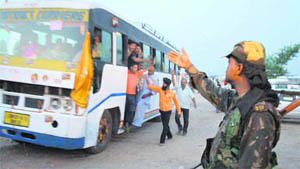 Paramilitary personnel maintain strict vigil as the first batch of Amarnath pilgrims start their journey in Jammu on Monday.
