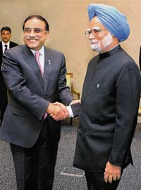Prime Minister Manmohan Singh shakes hands with Pakistani President Asif Ali Zardari at a meeting in Yekaterinburg, Russia