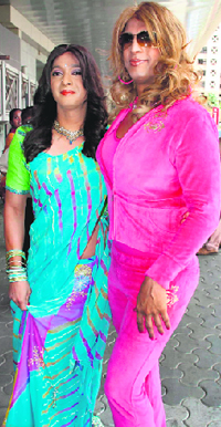 Actors Shreyas Talpade (left) and Javed Jaffari pose in costumes of their upcoming movie Paying Guest at a promotional event.