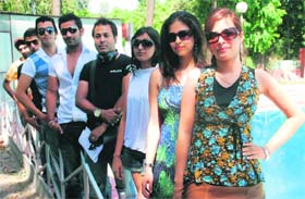 Kaushik Ghosh (second from left) strikes a pose with the models