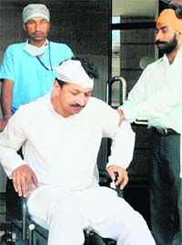 Amarjit Singh, Additional Superintending Engineer, PSEB, being taken out of hospital in Amritsar