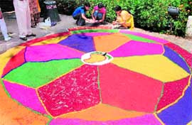 Fruits of labour: A rangoli takes shape.