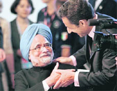 Prime Minister Manmohan Singh and French President Nicolas Sarkozy during a meeting of G8 summit in LAquila, Italy, on Thursday.