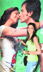 Actor Deepika Padukone poses in front of a poster during her visit to a multiplex to promote her movie Love Aaj Kal in Mumbai.