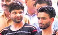 Hizbul Mujahideen militants, Javed Ahmed and Ashiq Ali, being produced before the media in New Delhi