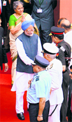 Prime Minister Manmohan Singh, with his wife Gursharan Kaur, shakes hands with Services chiefs as he prepares to leave after attending the Independence Day function at the Red Fort in New Delhi on Saturday.