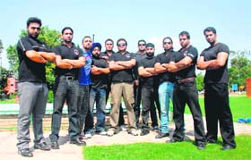 TOUGH ACT: Rubby Singh (centre) with his fleet of bouncers