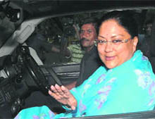 BJP leader and former Rajasthan Chief Minister Vasundhara Raje arrives to meet party leader LK Advani at his residence in New Delhi on Saturday.