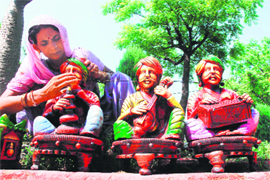 An artisan paints a sculpture at the Craft Bazaar-09, an exhibition-cum-sale of handicrafts, fabrics, home accessories and furniture at Lajpat Rai Bhawan-15.