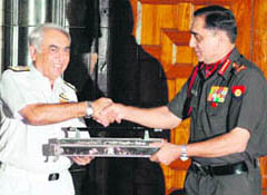 Outgoing Chairman of the Chief of Staff Committee, Admiral Sureesh Mehta, handing over the charge to General Deepak Kapoor at a function in New Delhi on Monday.