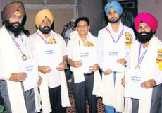 Teachers with state awards strike a pose at the Teacher’s Day celebrations in Ludhiana on Saturday.