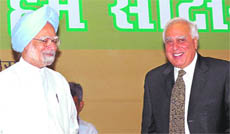 PM Manmohan Singh with HRD Minister Kapil Sibal at the launch of Sakshar Bharat on International Literacy Day in New Delhi on Tuesday.