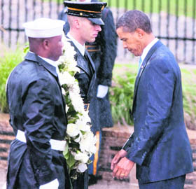 US President Barack Obama lays a wreath at the Pentagon during a ceremony on the eighth anniversary of the 9/11 attacks in Arlington, on Friday.