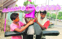 Children prepare an effigy of Ravana in Ludhiana