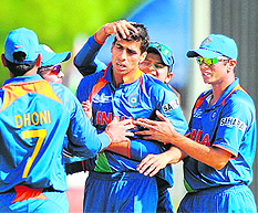 Ashish Nehra (C) celebrates the wicket of Kamran Akmal with teammates during the ICC Champions Trophy match between India and Pakistan at Centurion on Saturday. Shoaib Malik scored 128 as Pakistan finished at 302 for nine in 50 overs. Nehra, the most successful Indian bowler, took 4/55.